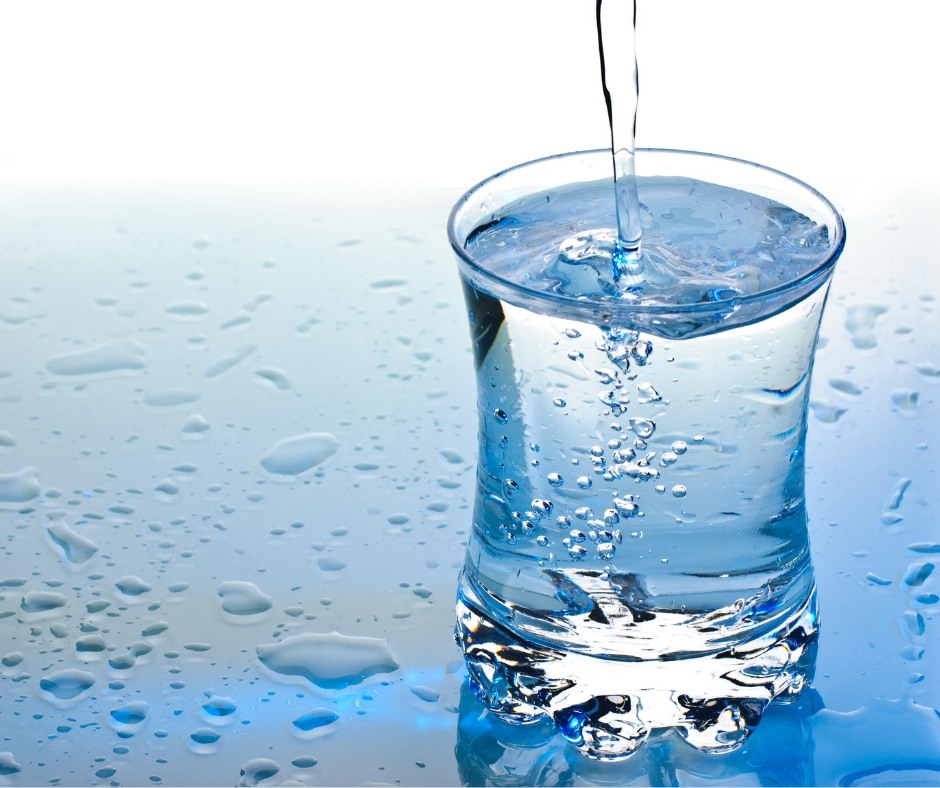 Glass cup filling with water